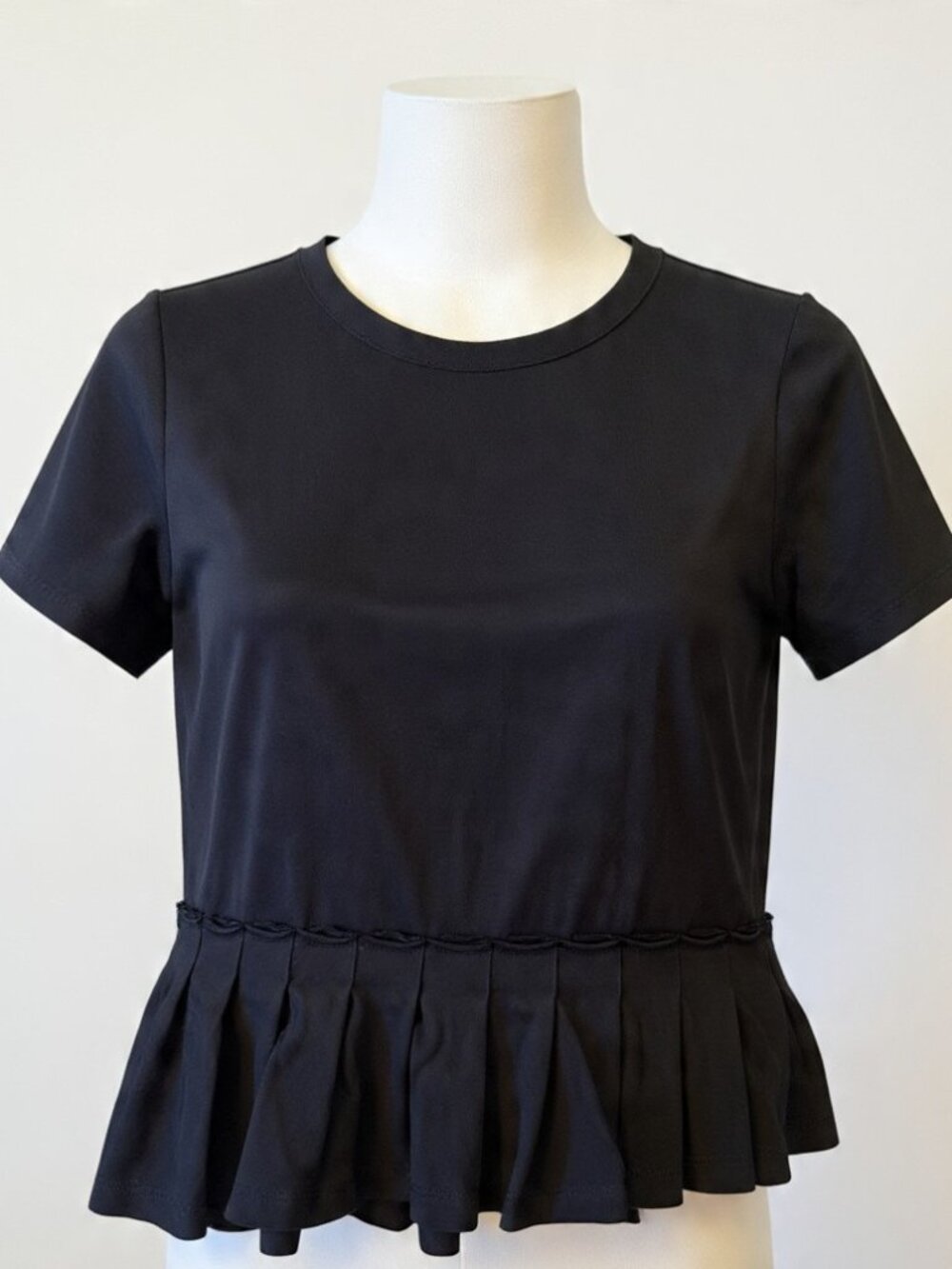 KINLY Black Peplum Top XS Short Sleeve Box Pleat Angled Hem
